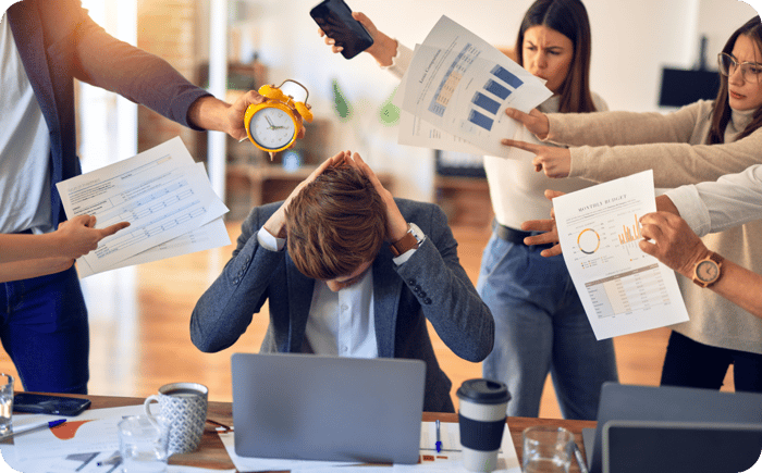 Group of business workers working together. Partners stressing one of them at the office